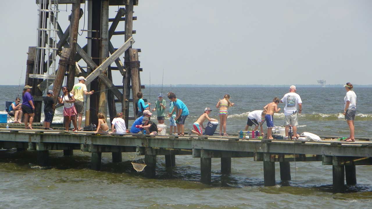 Campers work on their fishing skills.