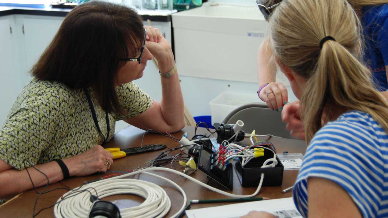 Workshop participants learn how to wire an ROV