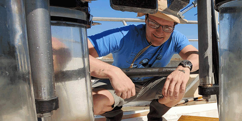 Scientist checking hadrware on a boat