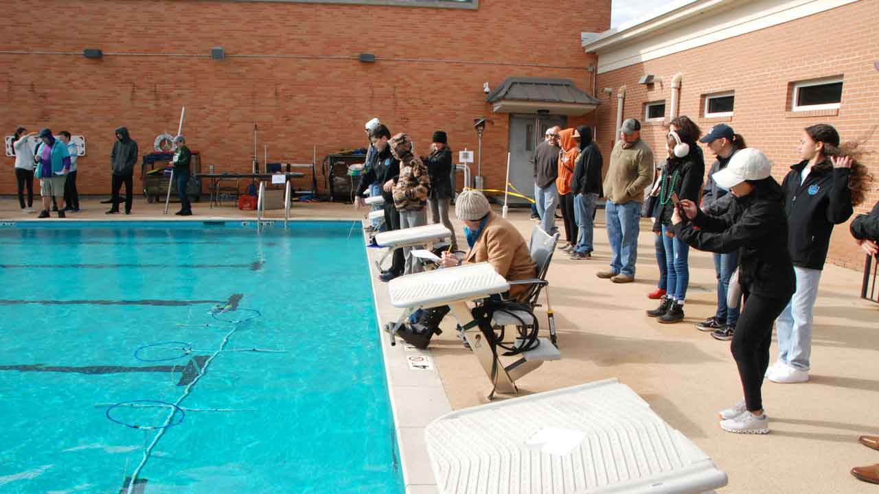 Wide view of poolside competition at UMS-Wright