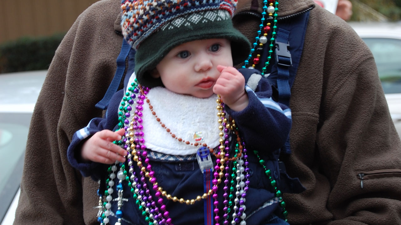 child holds beads