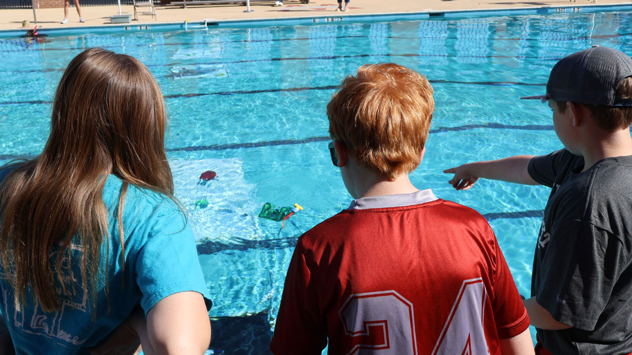 team competing in obstacle course