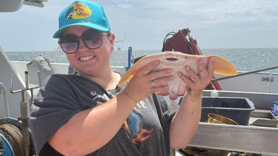 student holding ray